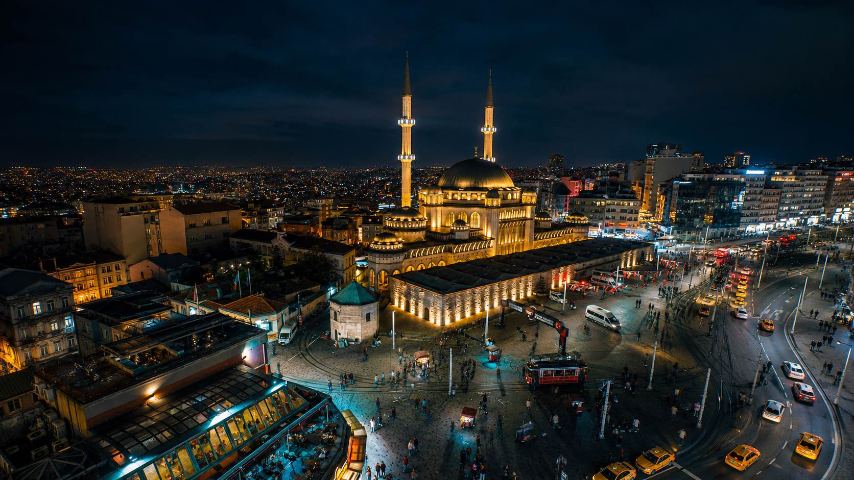 Taksim Square at night in Istanbul with Taksim Mosque and city lights