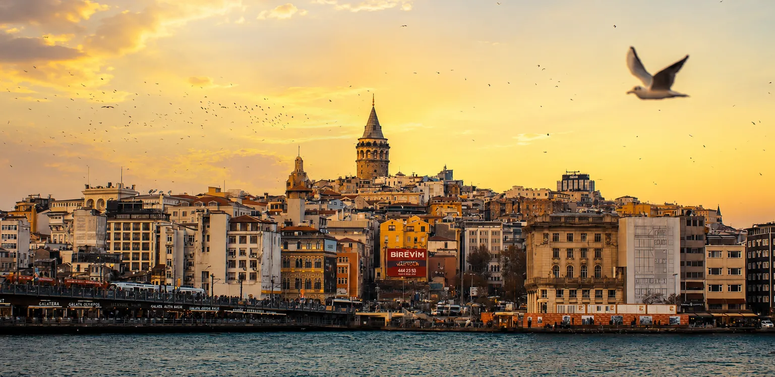Early morning view of Galata Tower and the historic Karaköy waterfront in Istanbul.